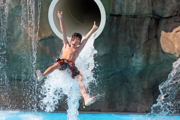 Child Flying Out Of A Waterslide