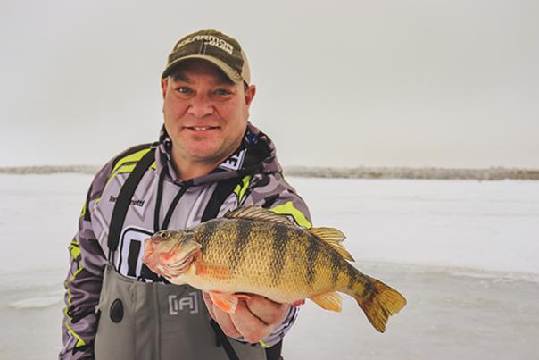 Fisherman holding Perch