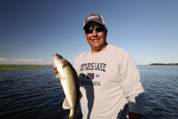 Johnnie Candle holds up a large Devils Lale North Dakota walleye.