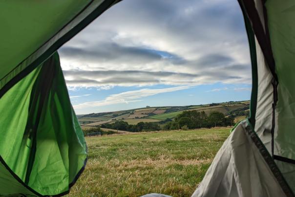 View of countryside through tent door