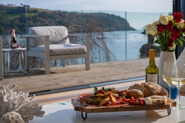 food on a balcony overlooking the ocean
