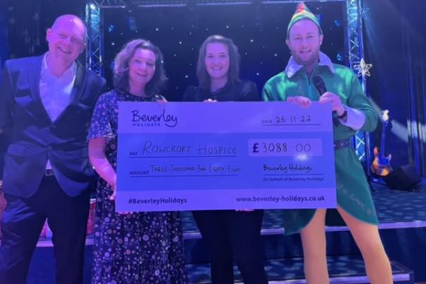 image shows team from beverley holidays with cheque