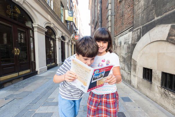 children reading a map
