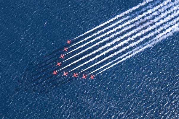 The Red Arrows flying over the sea at Sidmouth Air Show and Regatta
