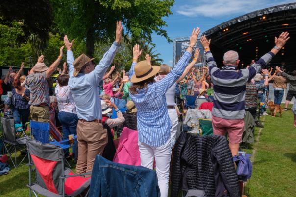 people standing in cheer after a performance