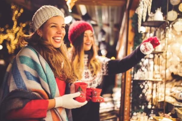 image shows women at christmas market
