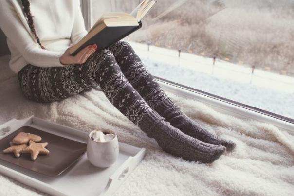 woman reading a book in the warm