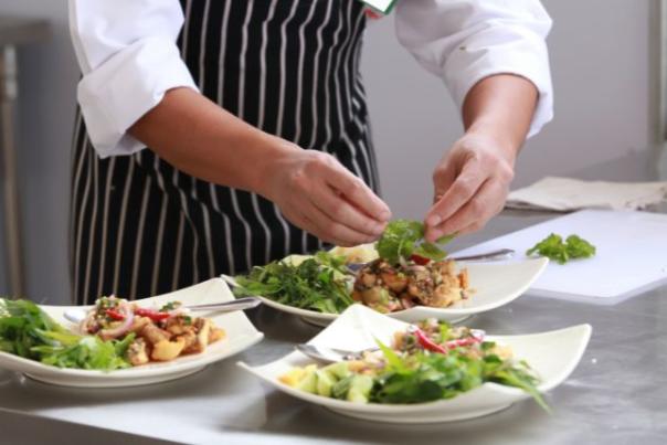 image shows chef preparing food