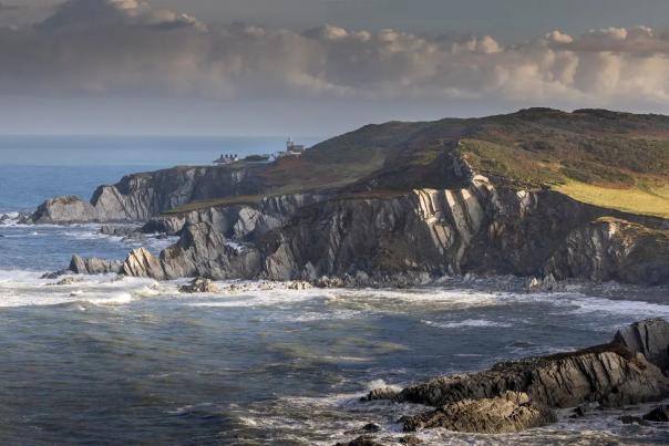 overlooking cliffs and the sea in devon on a cloudy day