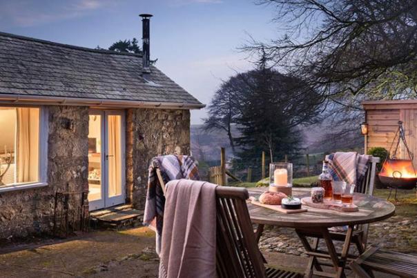 cottage with table and blankets