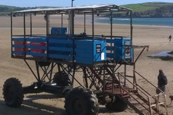 blue sea tractor on the beach