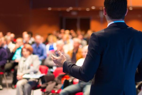 image shows person hosting a presentation