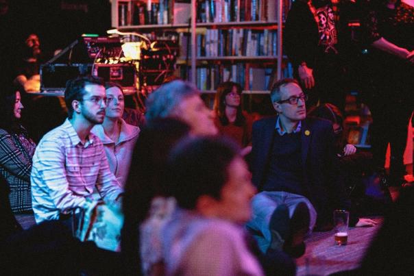 group of people enjoying an event in the library