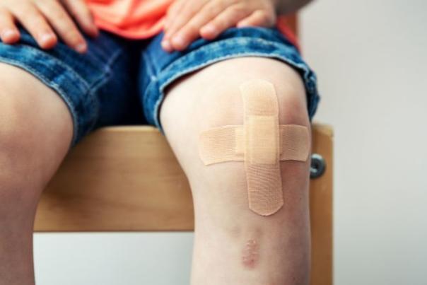 child with plaster on knee