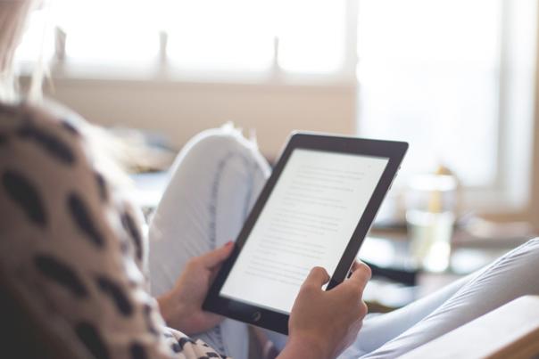 woman reading a kindle