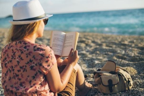 woman reading on the beach