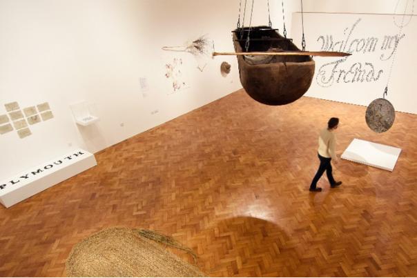 person walking through exhibition room