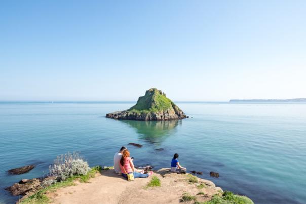 couple sat looking over coast
