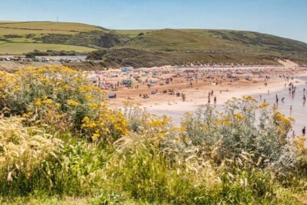 image shows the beach at woolacombe