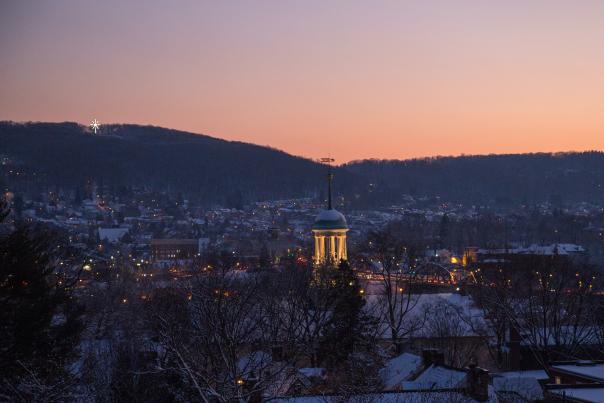 The Bethlehem Star and Central Moravian church visible at dusk during winter, Bethlehem, Pa.