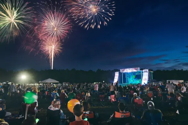 A full crowd of people enjoy a stunning fireworks display during Chelsea's Big Kaboom festival.