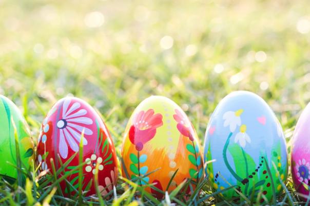 Five painted Easter Eggs on grass