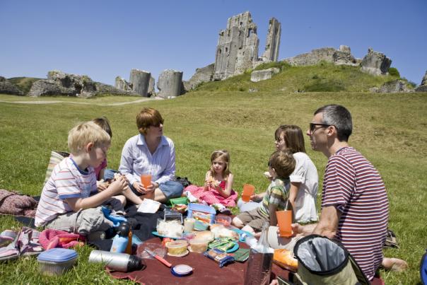 Family having a picnic at Corfe Castle, Purbeck, Dorset