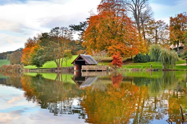 The boathouse and lake at Sherborne Castle, Dorset in autumn