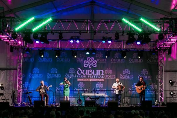 Irish band playing on the Celtic Rock stage at night at the Dublin Irish Festival.