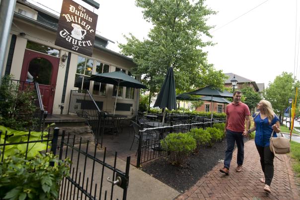 Couple walking to the Dublin Village Tavern Patio