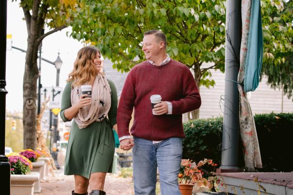 A couple enjoying coffee while strolling Historic Dublin streets in the fall
