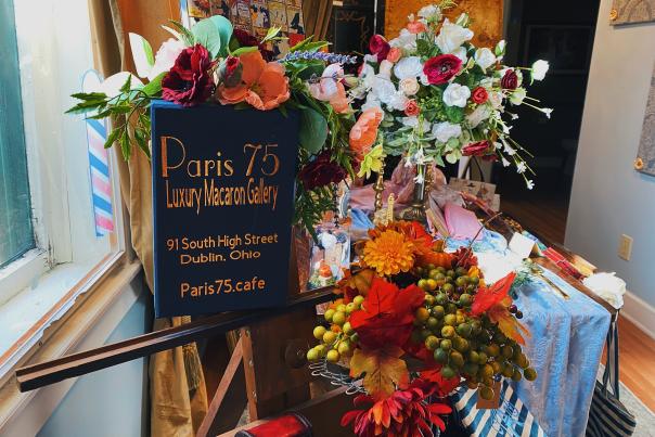 Floral sign with writing. "Paris 75 Luxury Macaron Gallery"