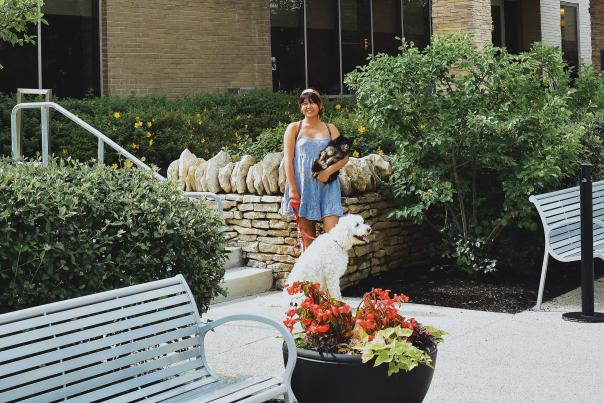 Chenny Tien outside of the Home 2 Suites hotel with her two dogs.