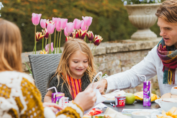 A family of three enjoying lunch at Sledmere House in East Yorkshire