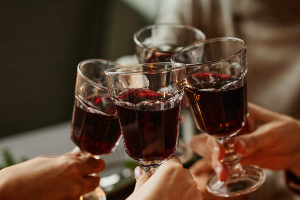 A group of people cheersing drinks