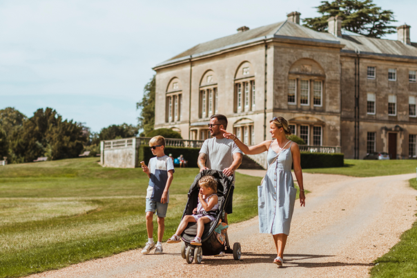 A family stroll in the sunshine with the magnificent Sledmere House in the background