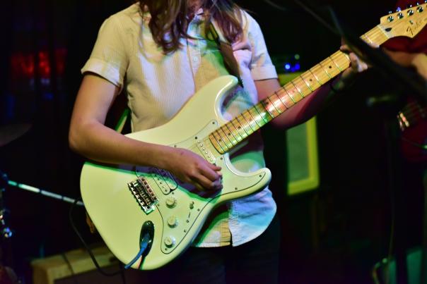 Musician with guitar at The Mousetrap in downtown Eau Claire