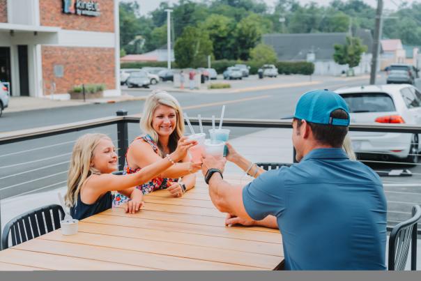 A family toasting their drinks at Kuddy's Sips and Sweets in Downtown Elizabethtown, KY