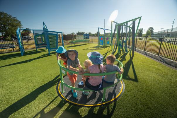 children enjoying a merry-go-round at funtopia