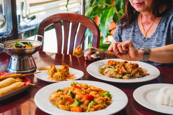Close up of a person eating food at 2bThai located in Elizabethtown, KY