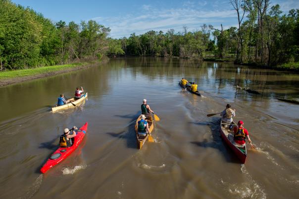 group paddling along the red river of the north