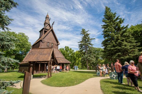 Crowd walking amongst the Stave church
