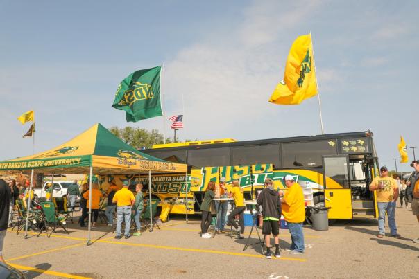 people in front of bus during bison tailgate