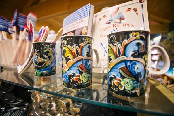 Stabo mugs and cookbooks on shelving