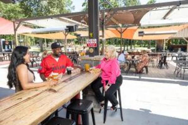 Image of two ladies and a male enjoying beers at Dirtbag Ales Brewery & Taproom
