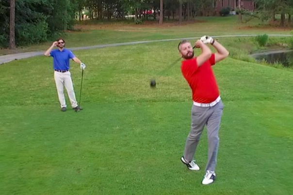 Image of two male golfer on the green