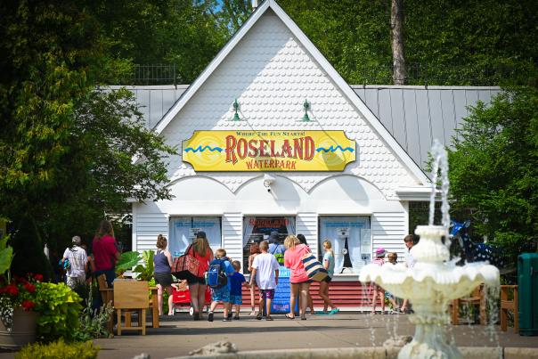 The entrance of Roseland Waterpark with people out front buying tickets