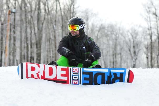 A snowboarder takes in the view at Bristol Mountain in the Finger Lakes