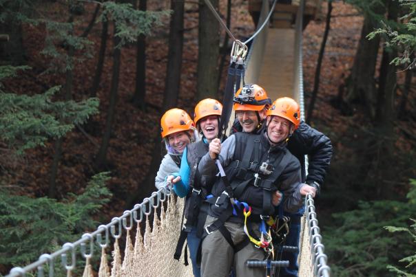 A group on a bridge at Bristol Mountain Aerial Adventures