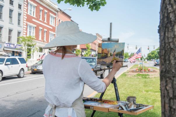 An artist painting a streetscape in Canandaigua